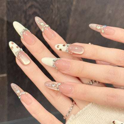 Refined oval nails with dimensional crystal chains, warm gradient & leopard accents - elegant meets edgy nail collection