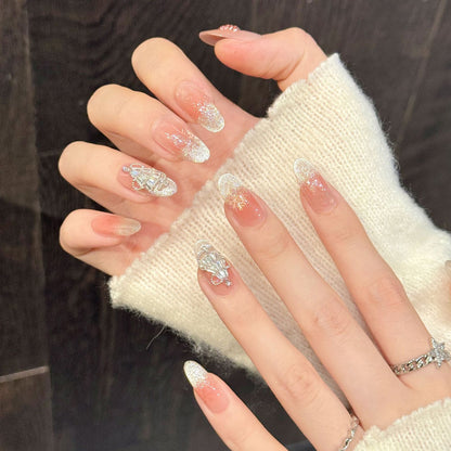 Romantic Christmas oval nails with warm gradient, silver snow effect & rhinestone-topped trees - refined festive nail collection