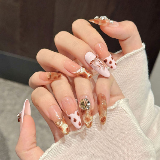 Romantic almond nails with pink bows, heart crystals, gold glitter & burgundy accents - perfect for pink bow heart crystal gold glitter sweet luxury charm