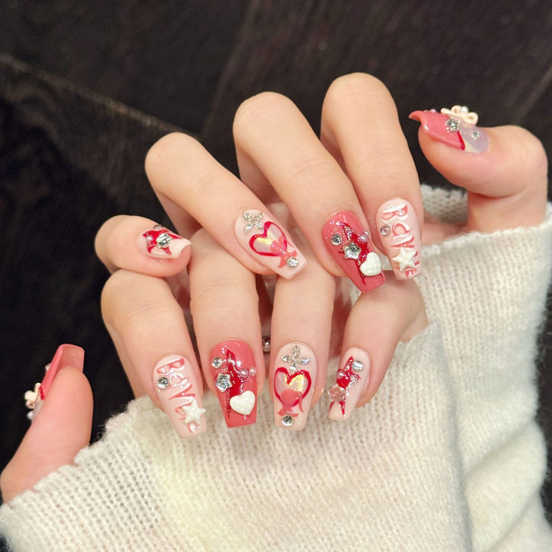 Romantic coffin nails with 3D hearts, crystal bow, love text & coral-pink gradient - perfect for love heart crystal bow romantic charm & sweet style