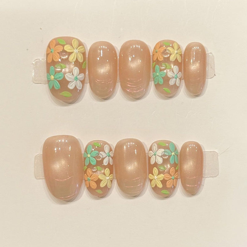 Romantic oval nails with 3D floral design, nude base, pastel spring flowers & gold beads - perfect for nude floral garden pastel spring romantic charm