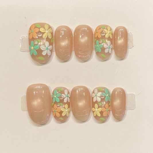 Romantic oval nails with 3D floral design, nude base, pastel spring flowers & gold beads - perfect for nude floral garden pastel spring romantic charm