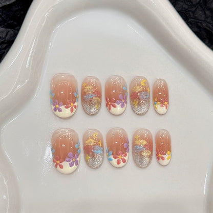 Salon-quality oval short press-on nails with blooming floral theme - perfect blend of nature & artistic elegance
