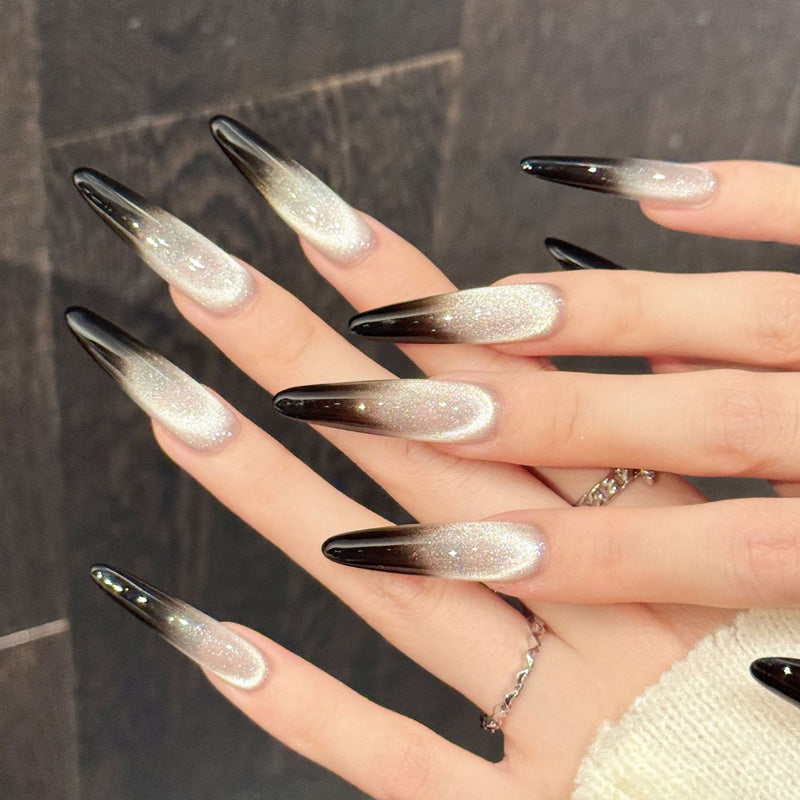 Show-stopping long stiletto nails with luminous champagne, smoky transition & jet black drama - refined edge nail collection