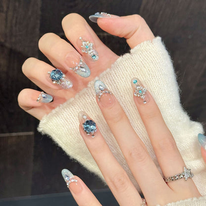 Sophisticated almond false nails featuring shimmering ombré, crystal chains & gemstone design - elaborate 10-piece jeweled set