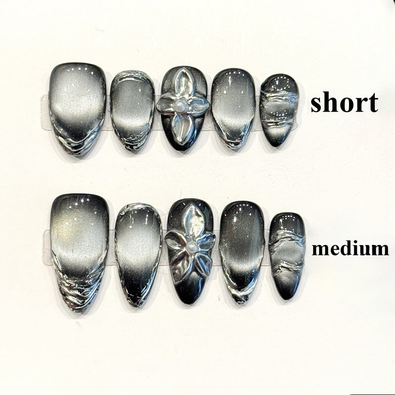 Sophisticated handmade almond nails with silver-black chrome gradient & 3D metallic flower - Modern elegant edge - Applies in 15 minutes