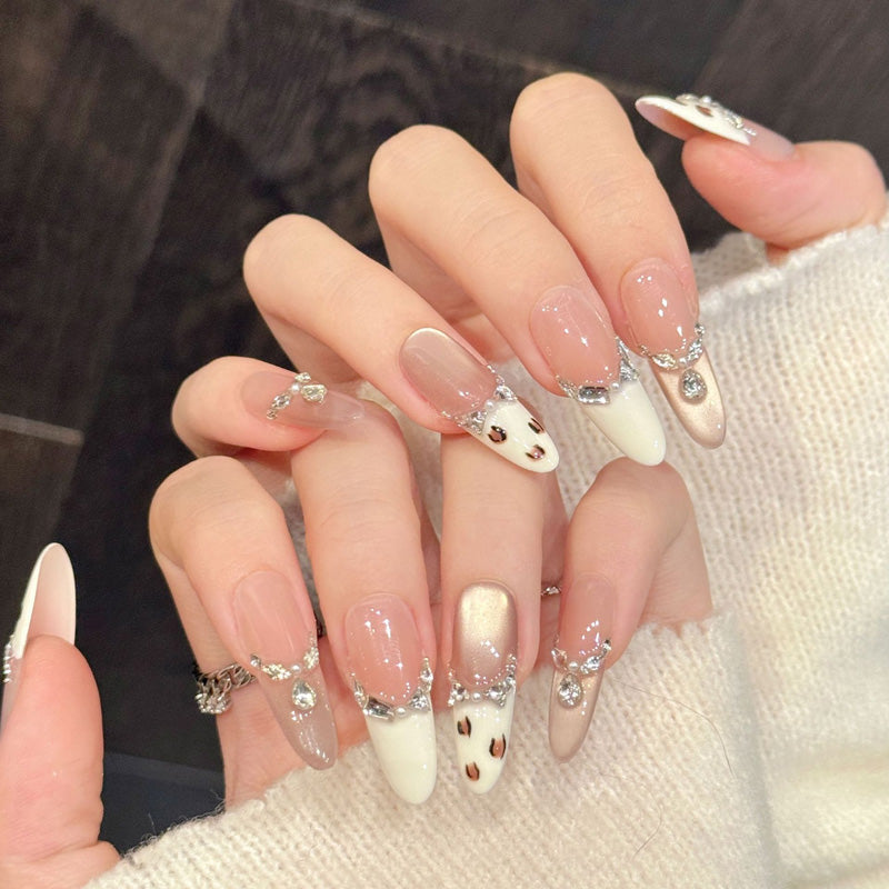 Sophisticated oval false nails featuring rhinestone chains, sunset ombré & animal print French tips - glamorous 10-piece set