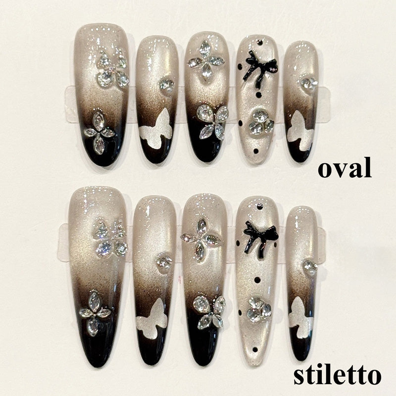 Sophisticated press-ons with smoky gradient, rhinestone butterflies & bow accents - available in oval or stiletto - elegant design