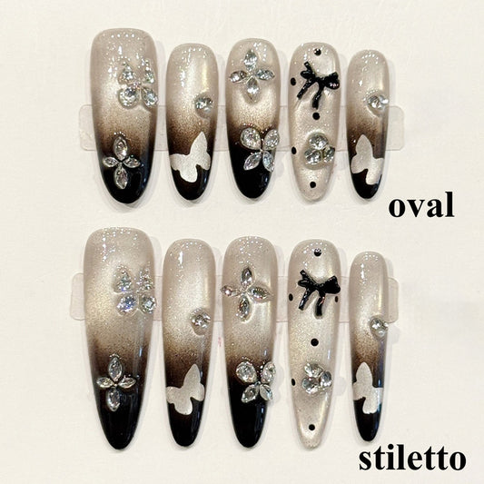 Sophisticated press-ons with smoky gradient, rhinestone butterflies & bow accents - available in oval or stiletto - elegant design
