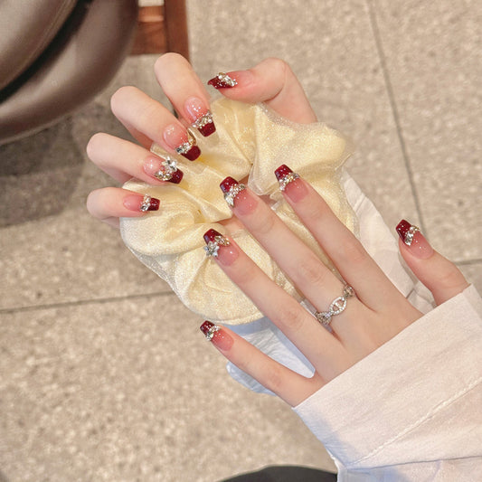 Stunning coffin-shaped medium nails featuring sparkling rhinestones, elegant ombré effect & high-end glossy finish