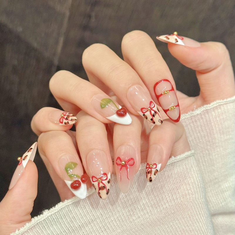 Sweet almond nails with 3D cherries, red bows, leopard print & gold beads - perfect for cherry bow leopard gold bead sweet kawaii charm style