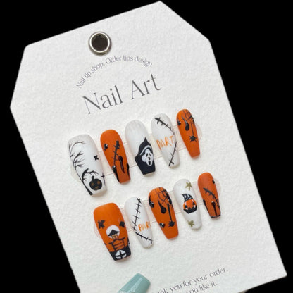 Terrifying Halloween Scream pumpkin coffin long press-on nails with iconic horror movie mask, jack-o'-lanterns, and spooky designs