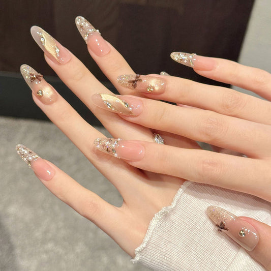 Timeless nude-pink oval false nails featuring delicate pearls, vintage bows & shimmering gradients - refined 10-piece luxury set