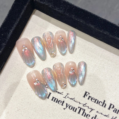 Transform your look with these stunning almond-shaped press-on nails in French gradient with chrome finish