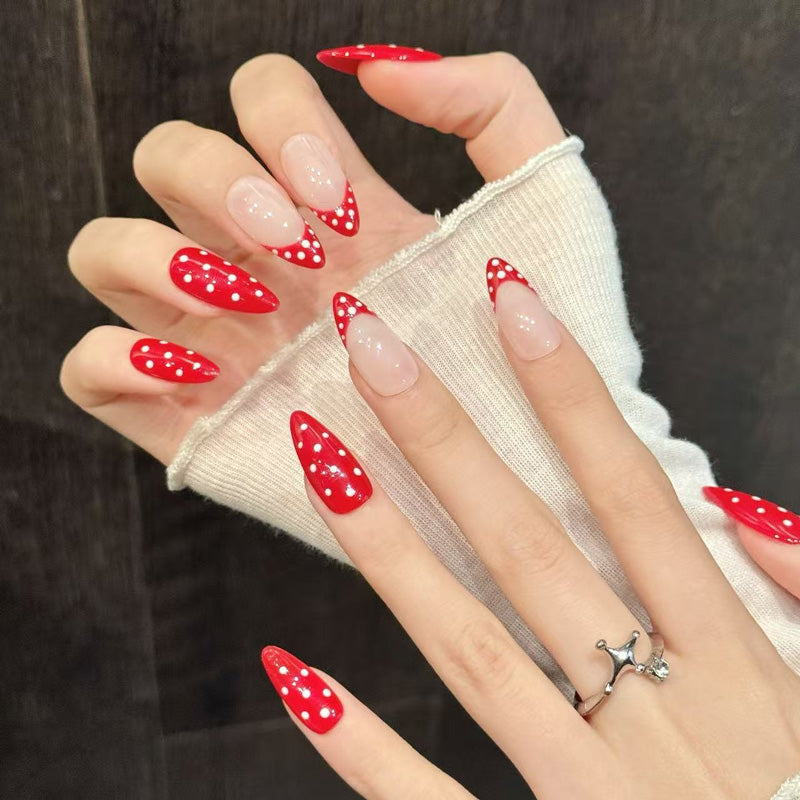 Vintage-inspired polka dot design on glossy red almond press-ons with nude balance - reusable 10-piece professional quality set
