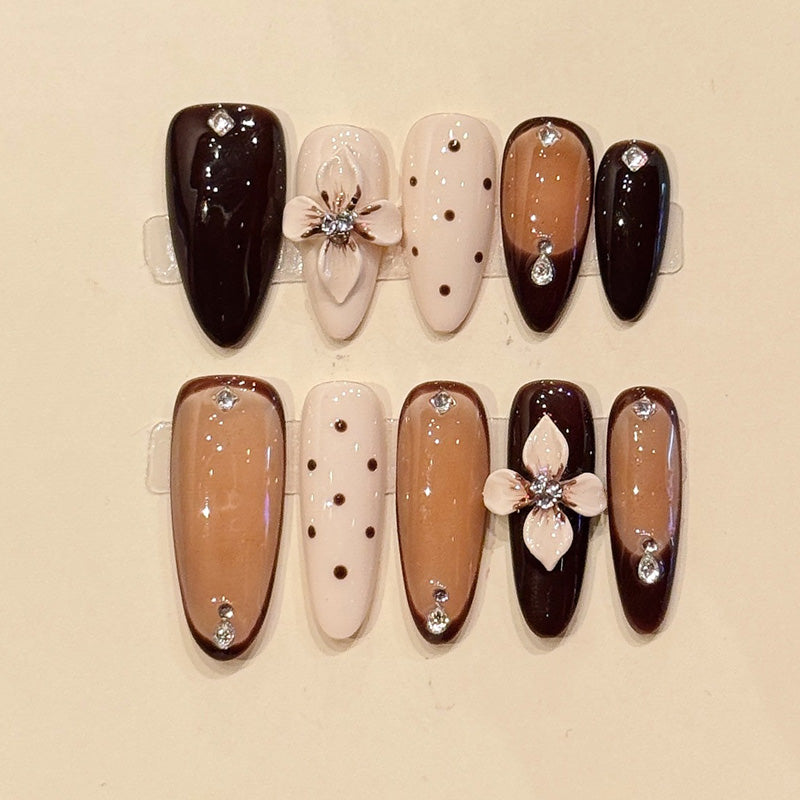 Warm chocolate & nude almond press-ons with 3D sculpted white florals, crystal centers & polka dots - handcrafted luxury nail art