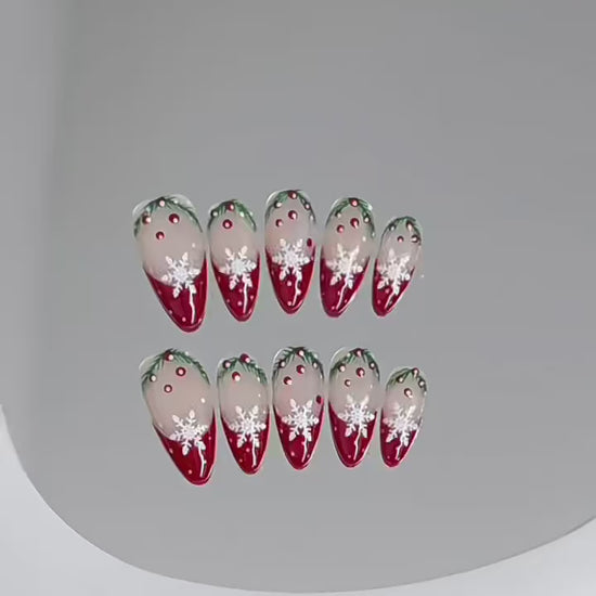 Premium almond press-on nails for Christmas elegance - delicate snowflakes, burgundy ombre, holly accents, perfect for holiday parties