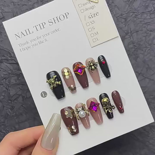 Handcrafted luxury Halloween nails featuring skull charms, spider motifs, rhinestones - coffin long shape for ultimate elegance